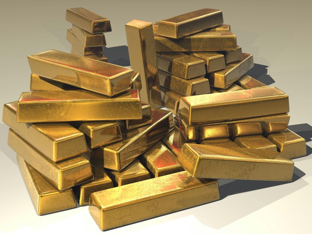 gold-ingots-golden-treasure-47047-47047 A pile of lustrous gold bars symbolizing wealth and prosperity.